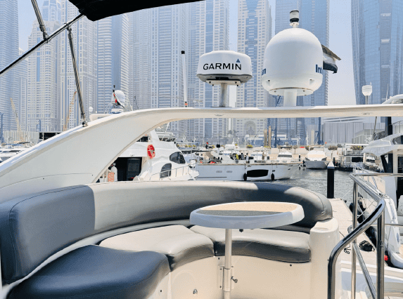 45ft Meridian yacht flybridge lounge with table Dubai Marina sunset cruise