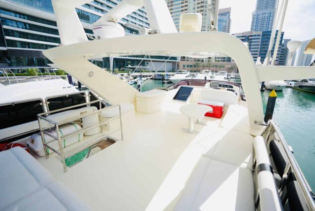 80ft Azimut yacht upper deck lounge with table Dubai Marina sunset cruise