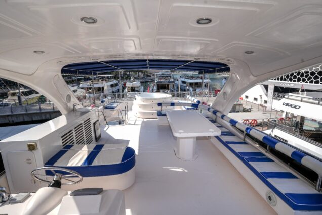 85ft Bu Mubarak with Jacuzzi upper deck lounge with table Dubai Marina sunset cruise
