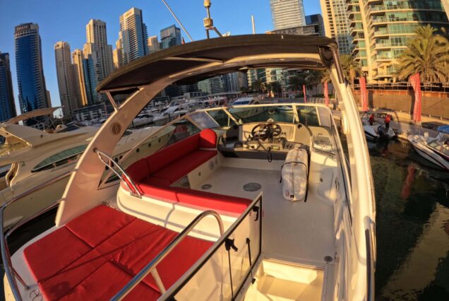 Luxury 47ft Ammos Cruiser upper deck lounge with table Dubai Marina sunset cruise