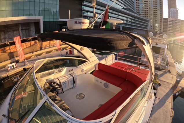 Luxury 47ft Ammos Cruiser upper deck lounge with table Dubai Marina sunset cruise