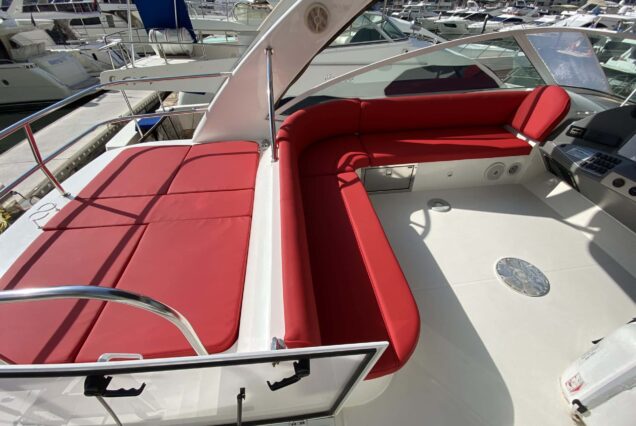 Luxury 47ft Ammos Cruiser upper deck lounge with table Dubai Marina sunset cruise