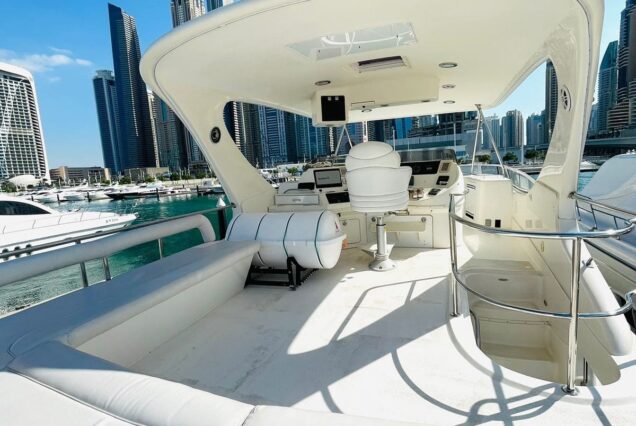 Luxury 63ft SEA RAY yacht upper deck lounge with table Dubai Marina sunset cruise