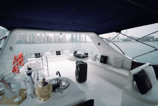 66ft Majesty Bella Vita upper deck lounge with table Dubai Marina sunset cruise