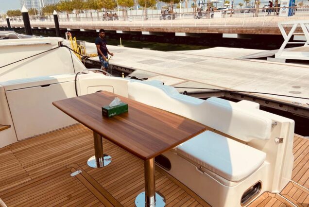 60ft Princess Yacht entrance gate with table and back seating area Dubai Marina rental