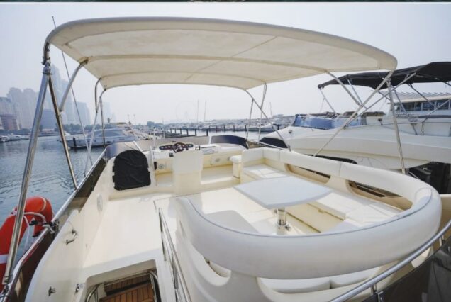 60ft Princess Yacht upper deck lounge with table Dubai Marina sunset cruise