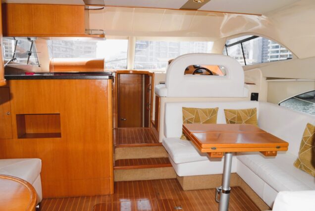 Rodman 44FT salon lounge with table Dubai Marina rental