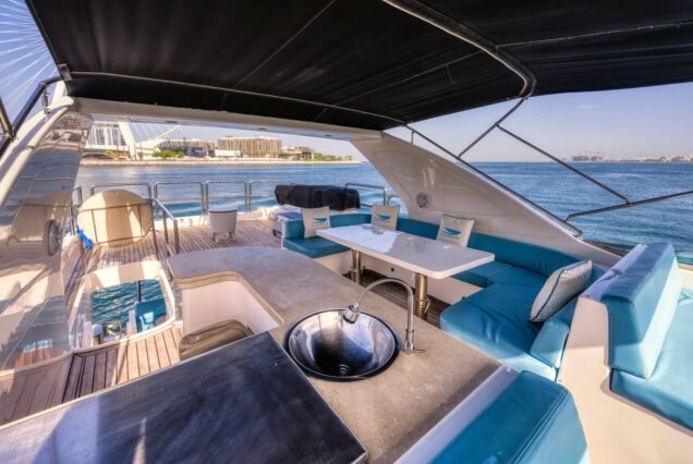 Luxury 77ft Diamond Dust Dubai upper deck seating with table for dining, drinks, and celebrations