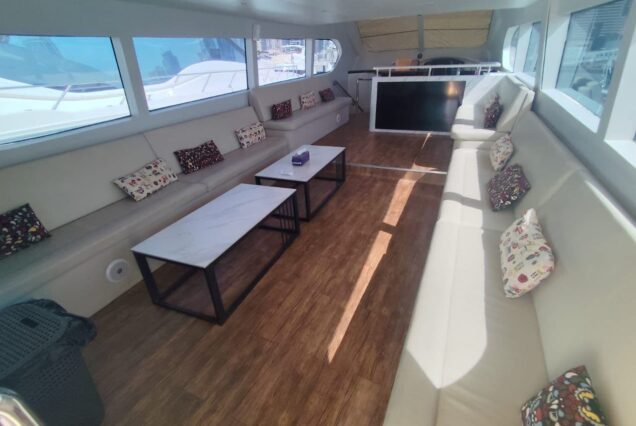 85ft Celebration Yacht Dubai stylish lounge with table for entertainment and social gatherings