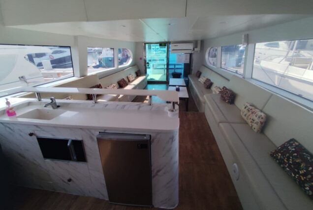 85ft Celebration Yacht Dubai stylish lounge with table for entertainment and social gatherings