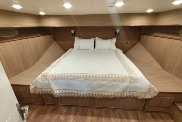 85ft Celebration Yacht Dubai guest cabin with elegant interiors and comfortable sleeping accommodations