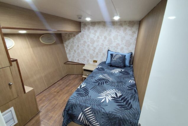 85ft Celebration Yacht Dubai guest cabin with elegant interiors and comfortable sleeping accommodations