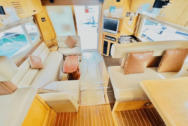 Majesty 48ft Yacht Dubai indoor salon with comfortable seating and a welcoming atmosphere