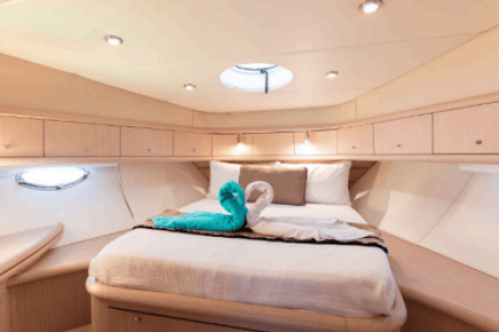 64ft Luxurious Sunseeker master cabin bedroom with bathroom Dubai yacht rental