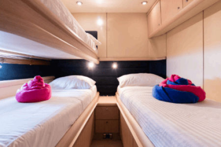 64ft Luxurious Sunseeker master cabin bedroom with bathroom Dubai yacht rental